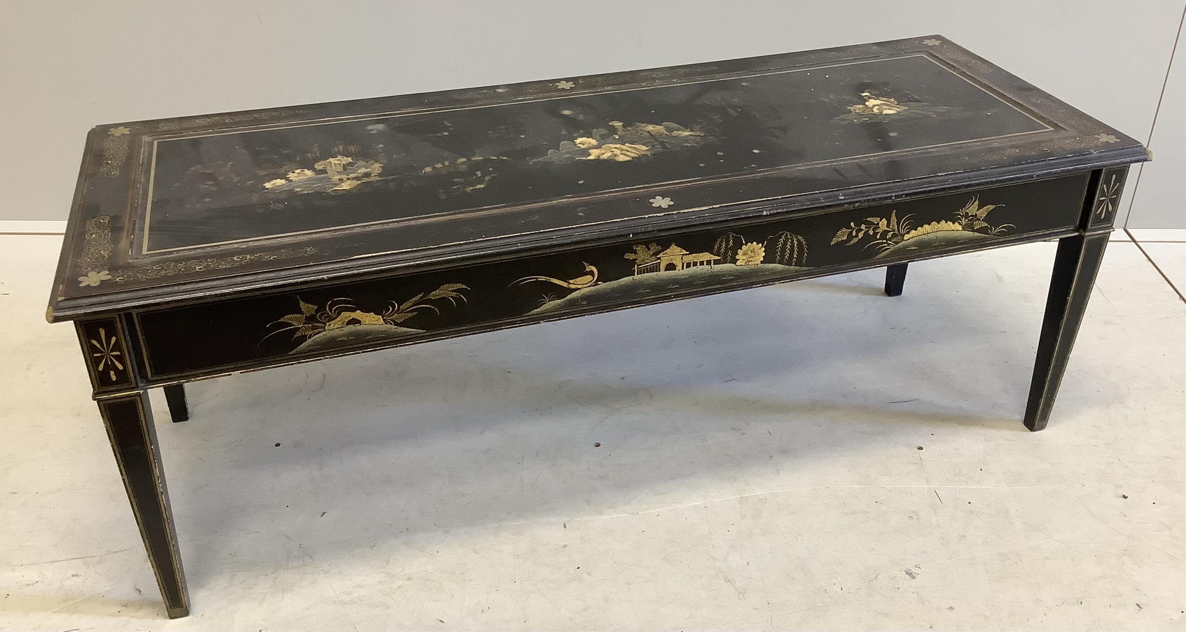 A rectangular black lacquered coffee table, width 120cm, depth 46cm, height 44cm. Condition - poor to fair